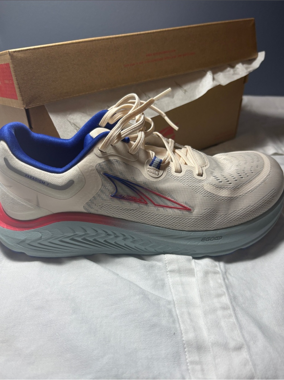 Altra Cream Running Shoe with Blue Lining and Pink Heel Accent